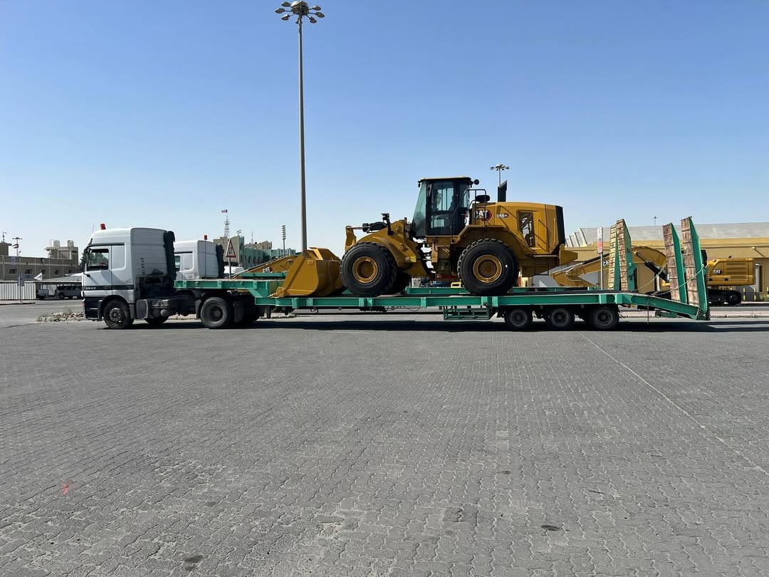 CAT 966M wheel loader on low-bed trailer at Al Shuwaikh Port